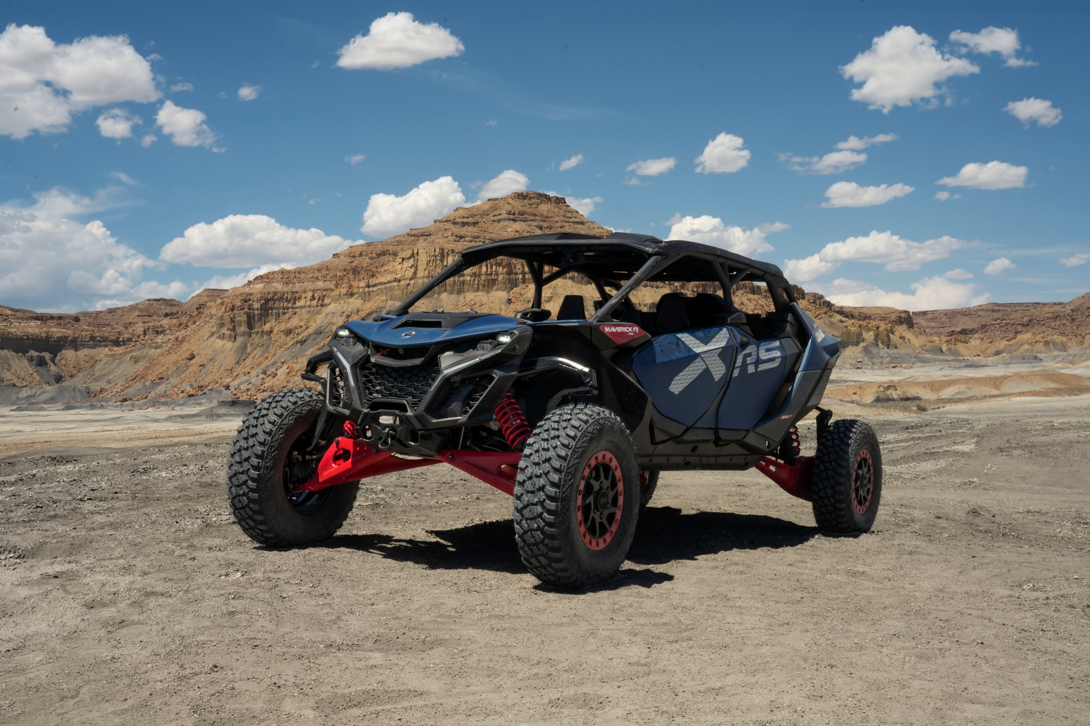 A Can-Am Defender SxS parked in a barn