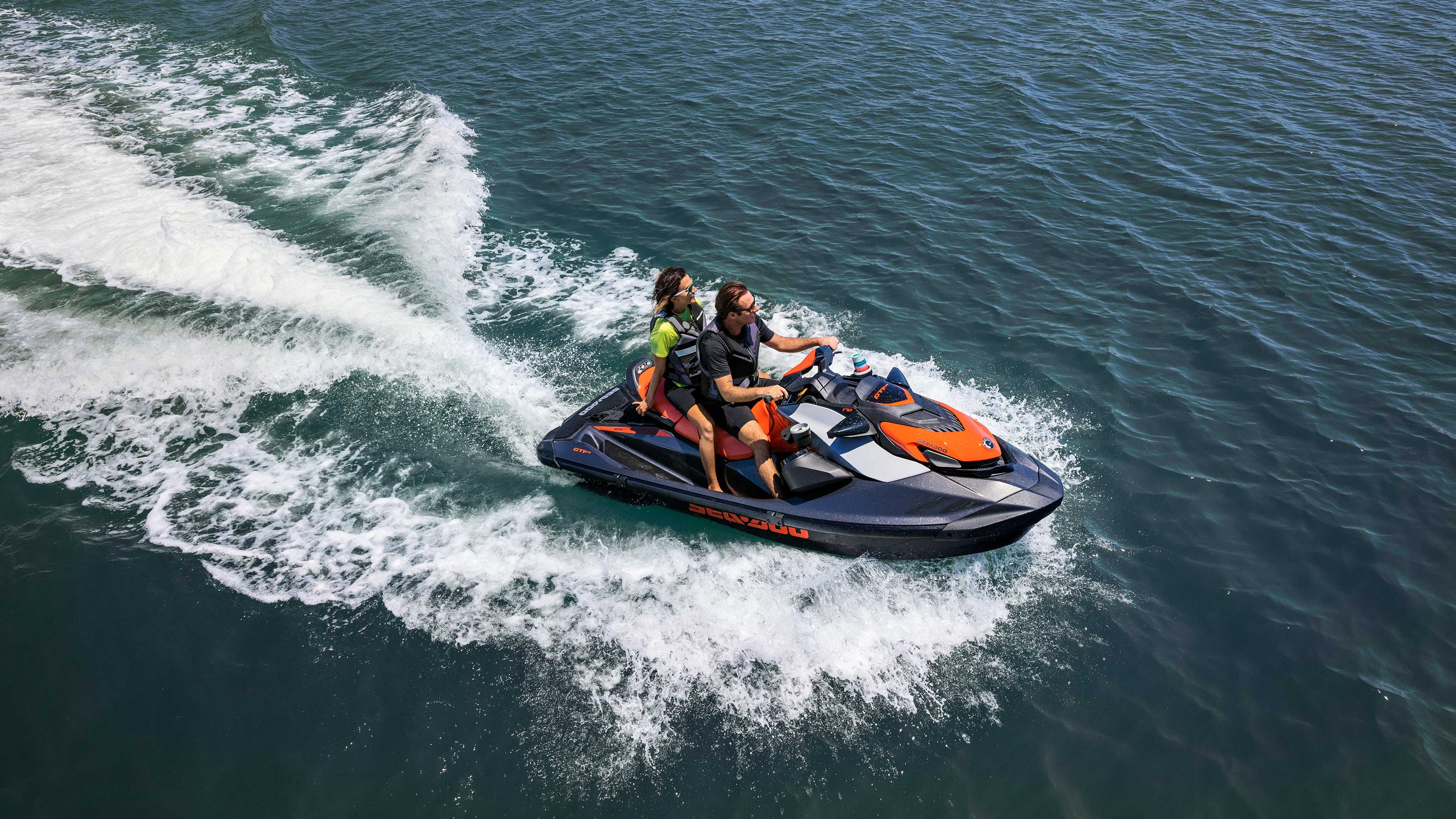 Couple riding a Sea-Doo GTI SE